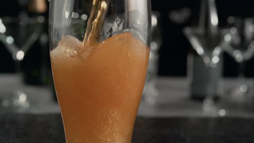 Beer is poured into a beer glass