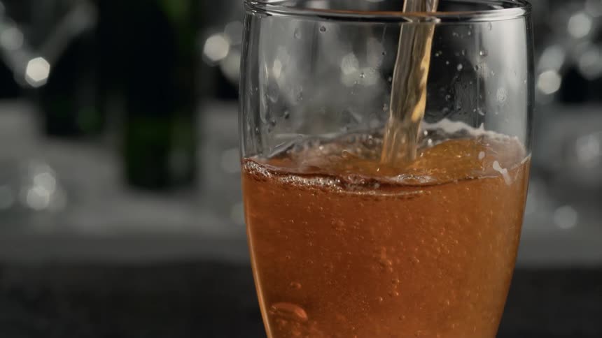 Beer pouring into glass in slow motion