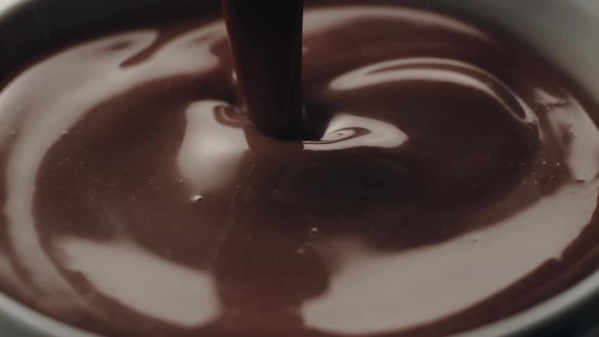 Chocolate milk pouring and splashing