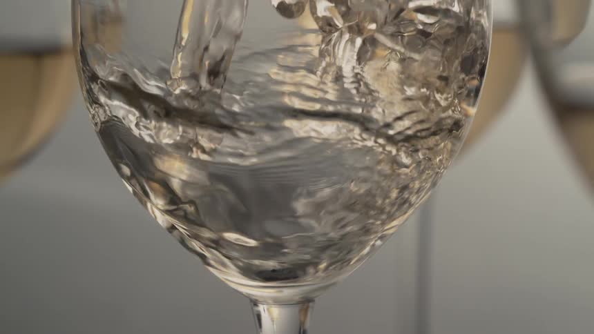 Wine is poured into a glass