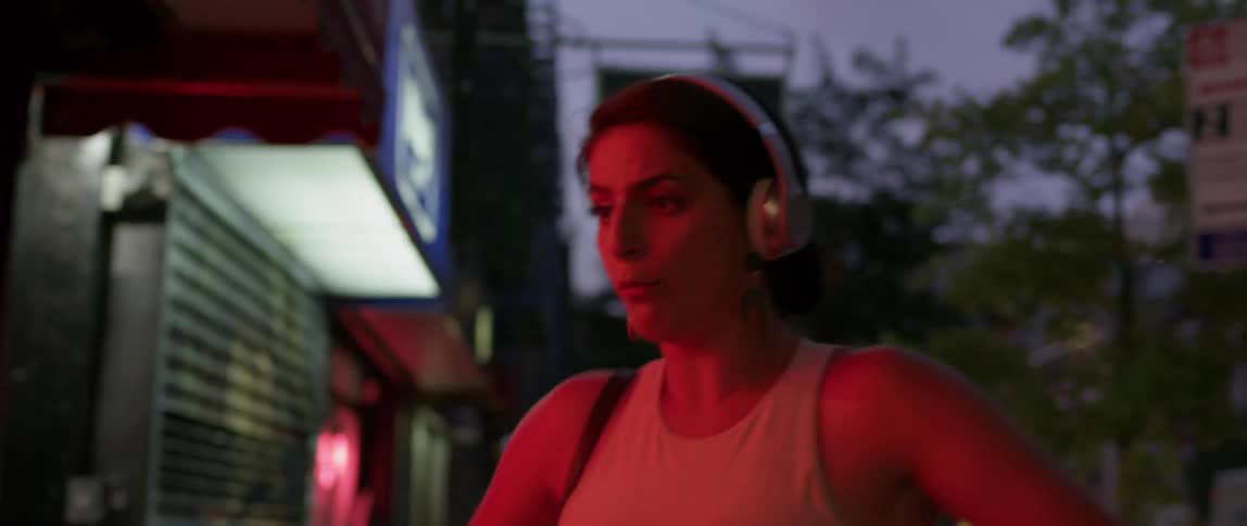 A woman is dancing at sunset