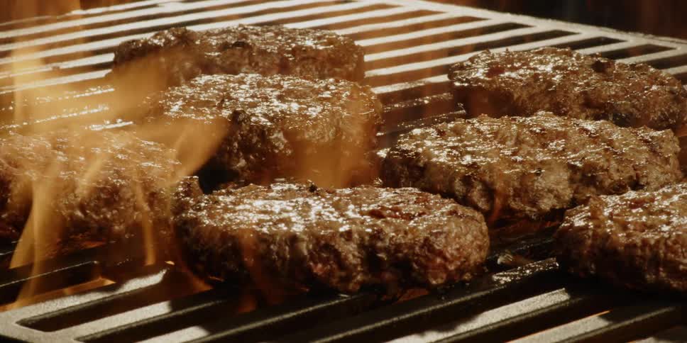 Burgers are cooked on the grill