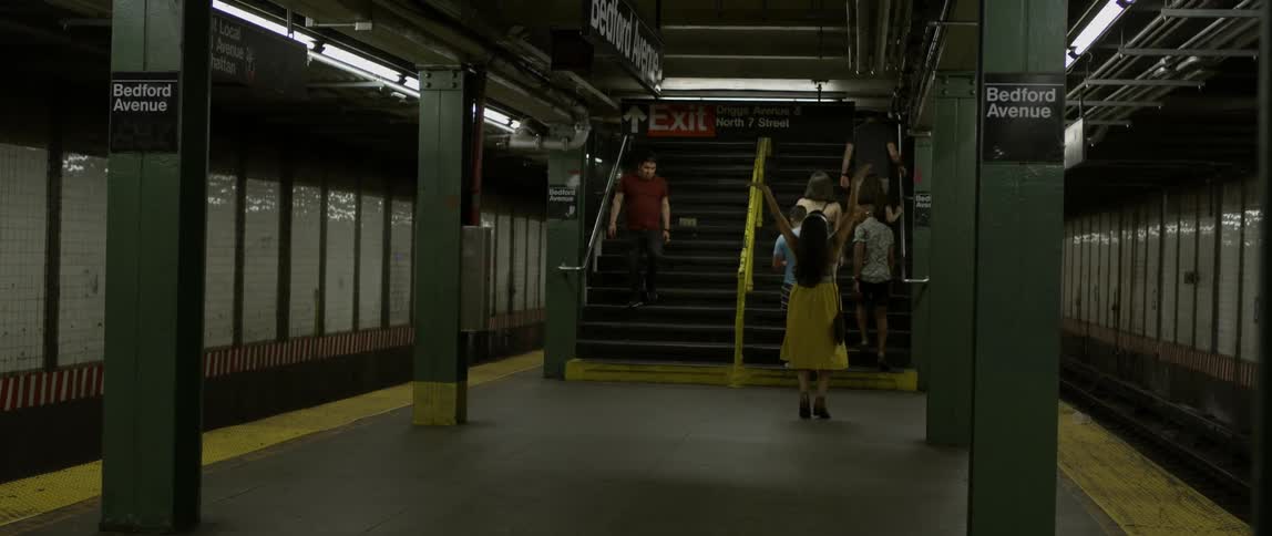 A woman in a yellow dress dances