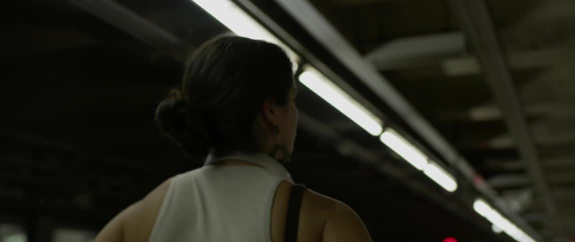A woman walks in the subway
