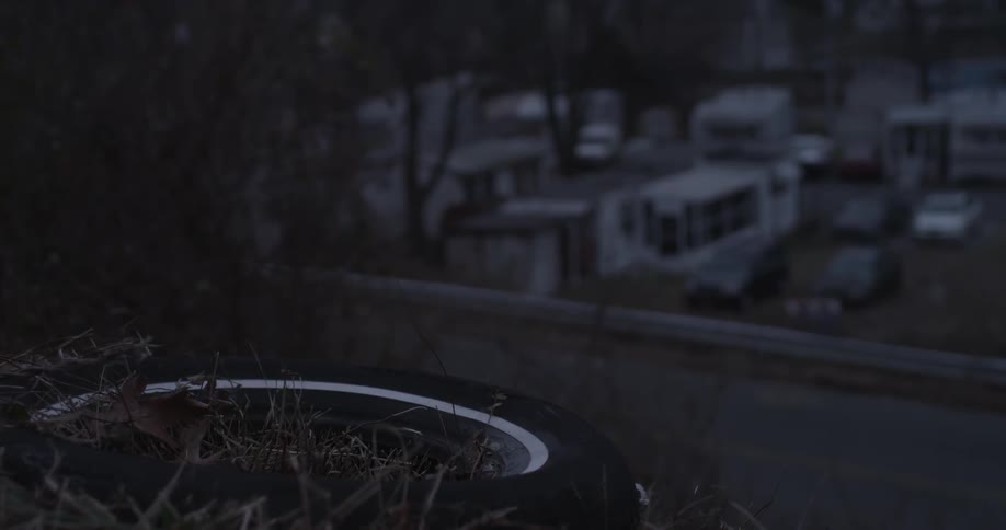 A view of a trailer park comes into focus