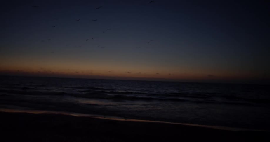 Waves flow onto the beach shore