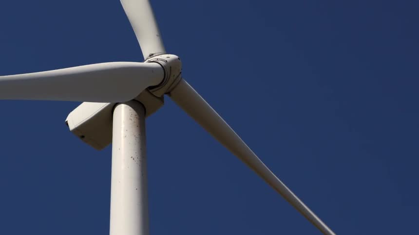 A windmill spins in the breeze