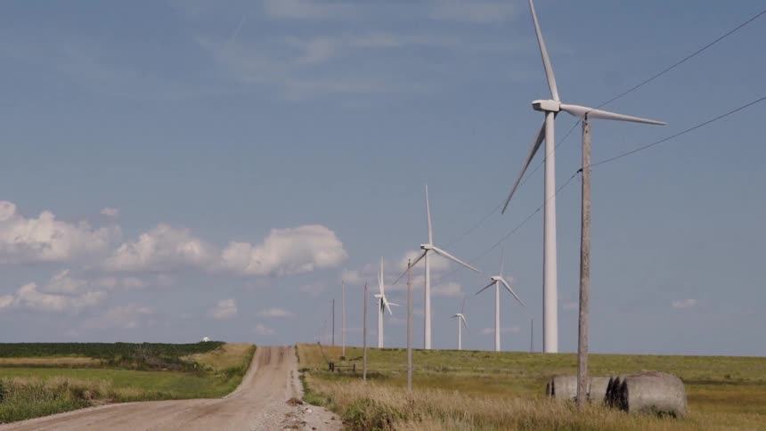 Windmills turn slowly in the country