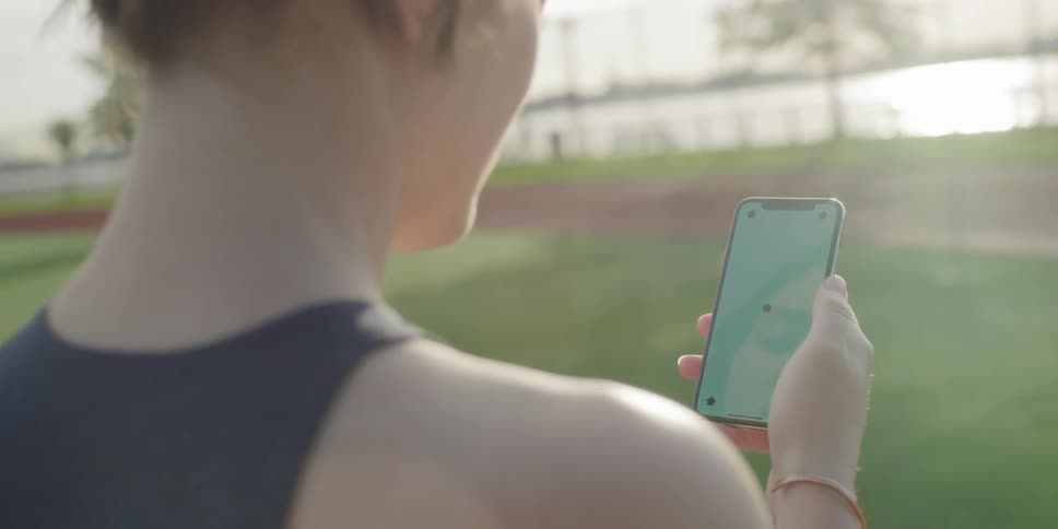Woman outside looking at smartphone