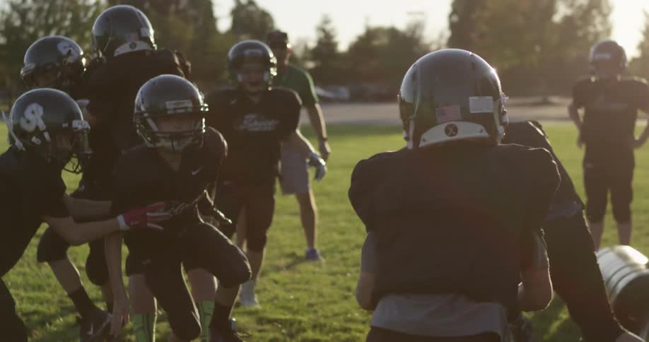 Junior football league running plays