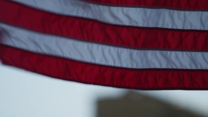 An american flag billows in the wind