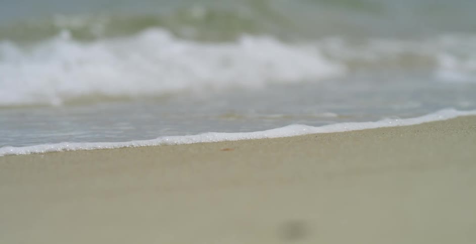 Waves crashing against the beach