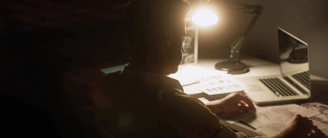 Man jolts awake while working at a desk