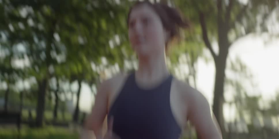 A woman jogs on the path