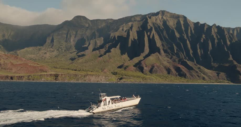 A boat speeds off on the water