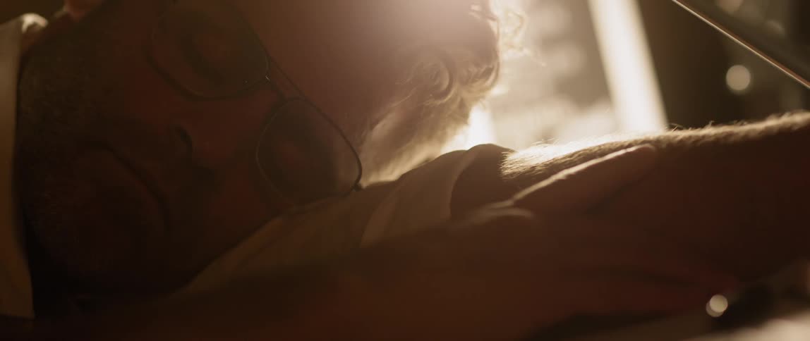 Man leaning on his arm asleep