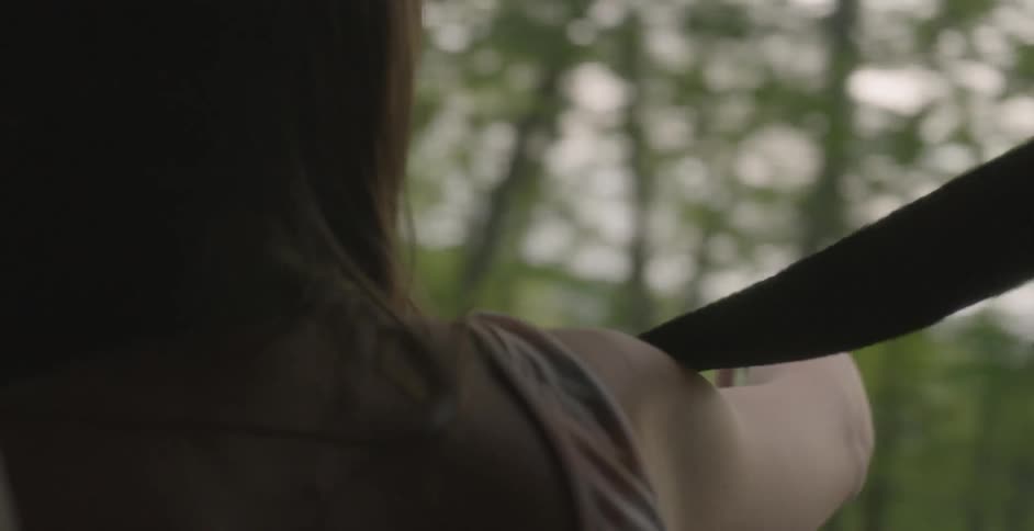 A person with their hand out of a window