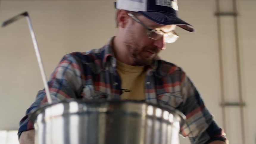 A man is working in a brewery