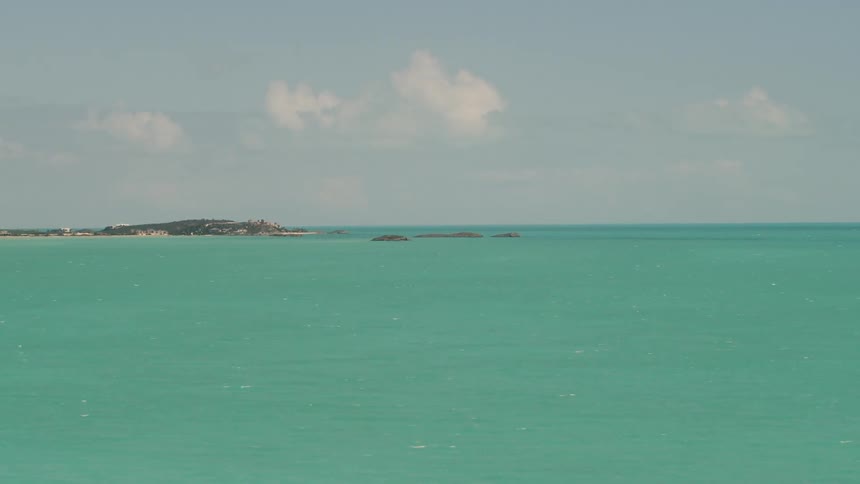 Turquoise water flows on an ocean