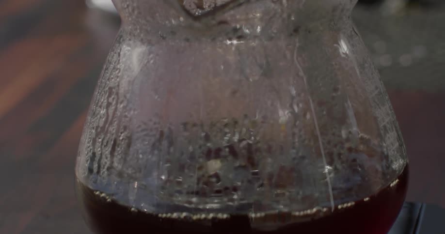 Coffee drips into a glass coffee pot