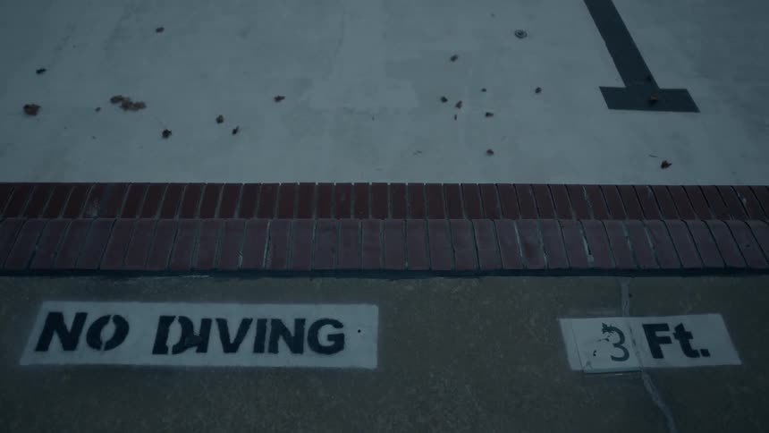 Friends Hanging Out At An Empty Pool