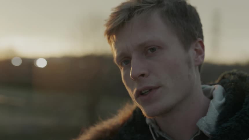 A man talks at sunset