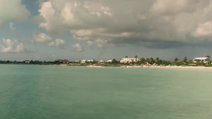 The clear blue water flows as a boat speeds off