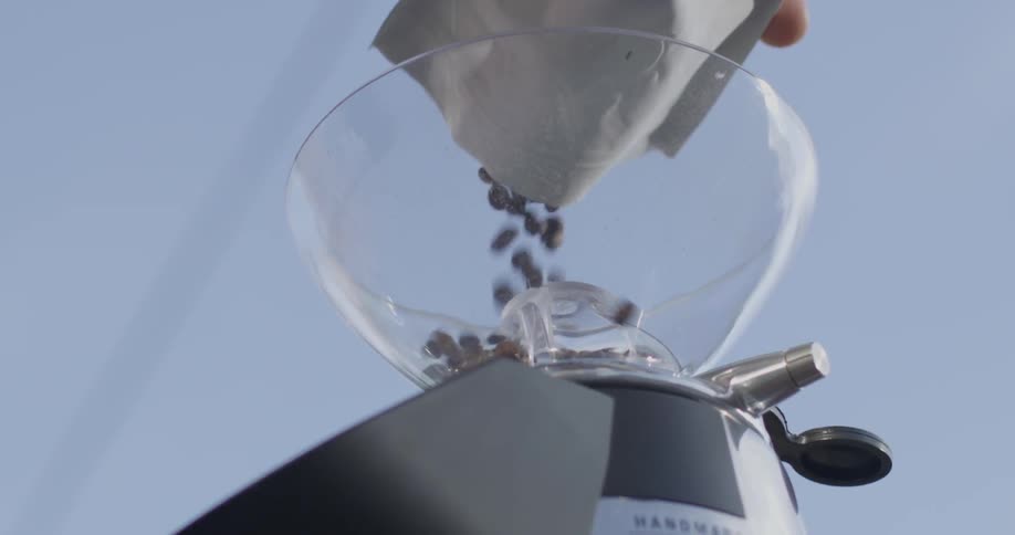 Coffee beans are poured into a machine