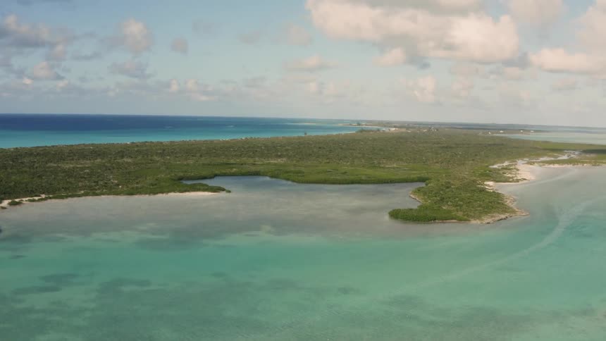 The island is surrounded by blue water