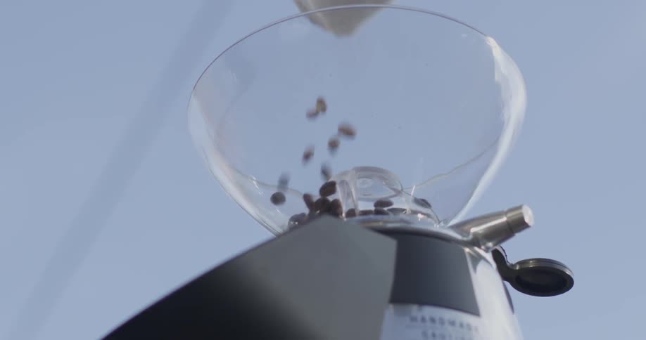 Coffee beans are poured into the machine