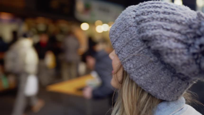 A young woman observes a street cafe in Tokyo