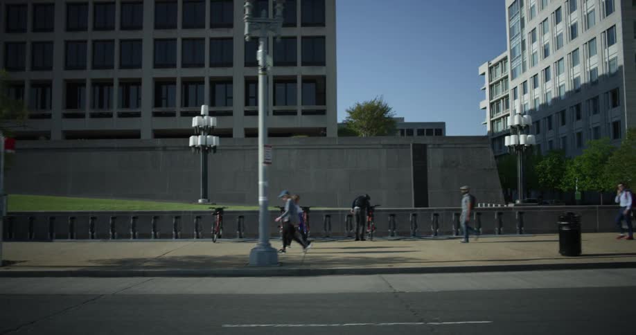 People walk in the city on a sunny day