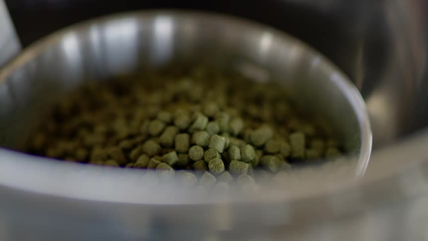 Pellets sit in a metal bowl