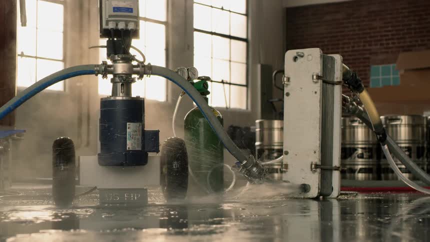 The water sprays all over the warehouse floor