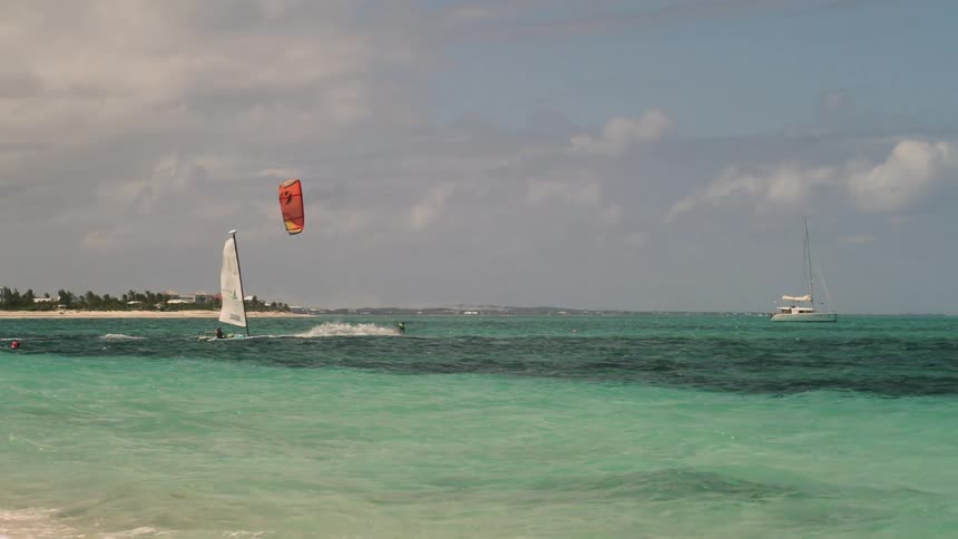 A person is parasailing in the water