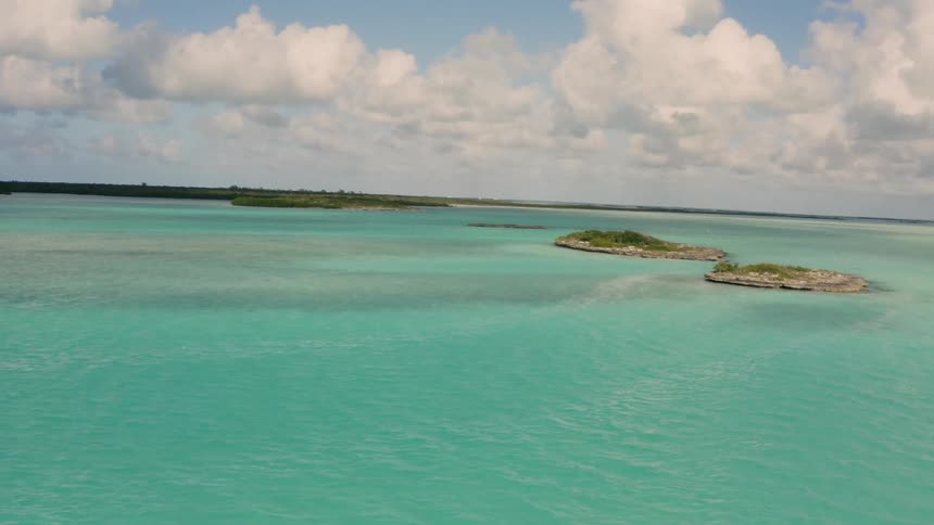 Clouds are hanging over a tropical lagoon during the day