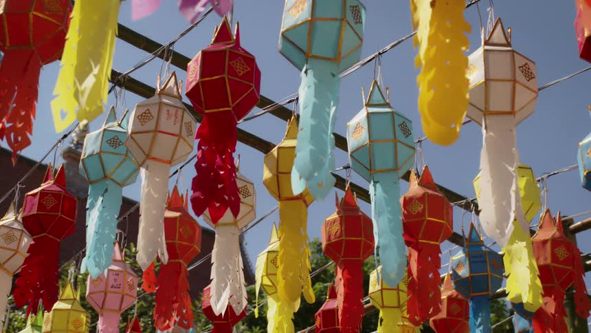 Lanterns hang on an apparatus outside