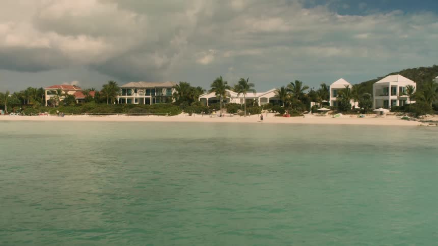 Clouds are hanging over a beach community on a stormy day