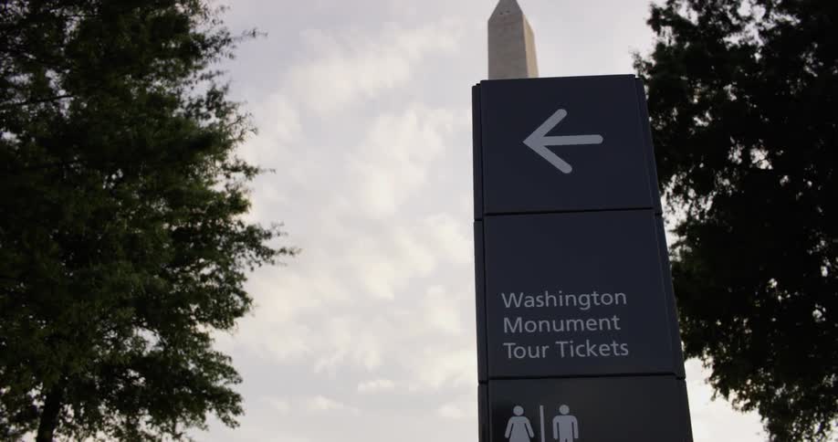 The sign points towards the washington monument