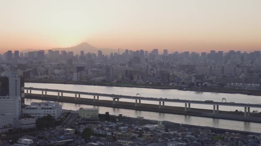 The bridge runs across the river in the city