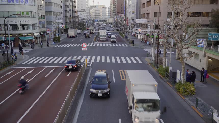 Cars travel on a city street