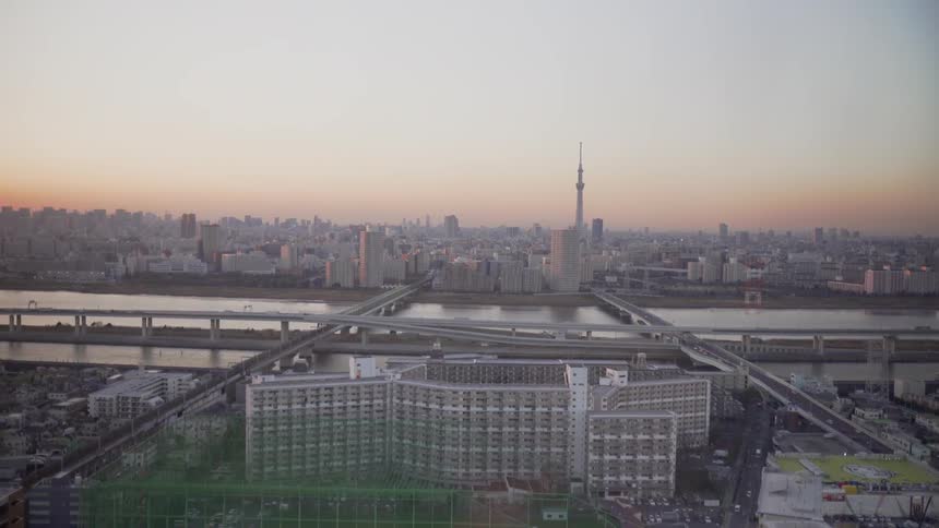 The sun sets over the Tokyo city skyline