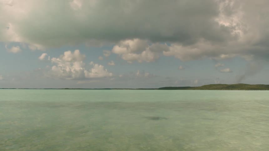 Water rolls gently in the lake under a cloudy sky
