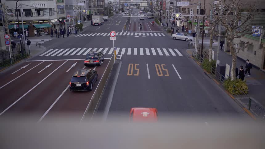 Vehicles travel on the city street