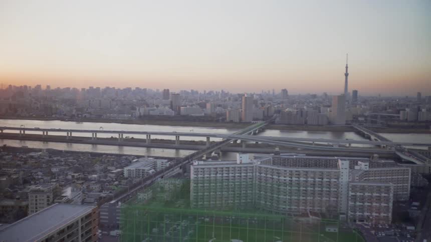 Traffic travels over a bridge near the river