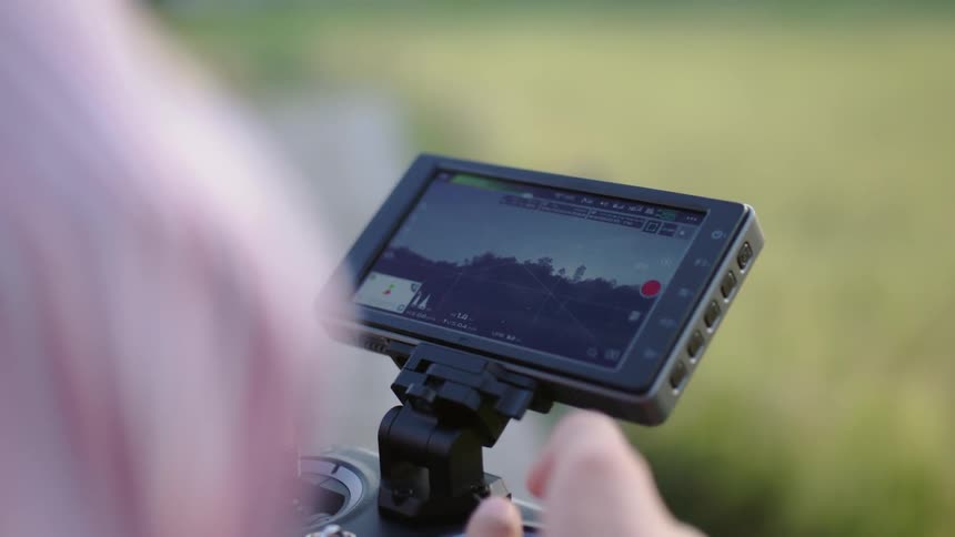 A camera operator monitors from a screen