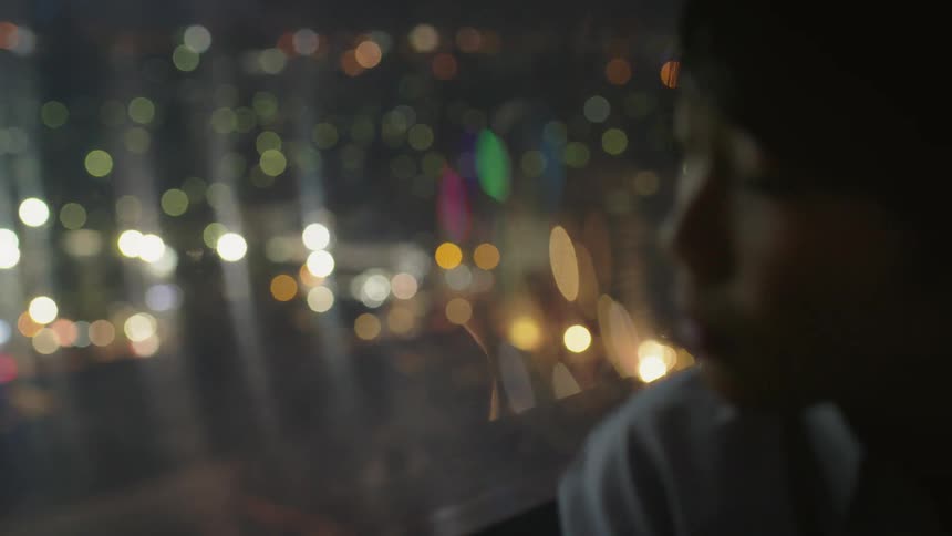 A person looks out of a window