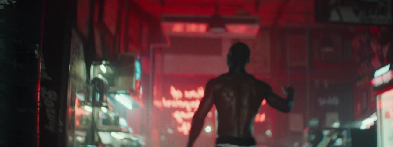 A man happily dances in a gym