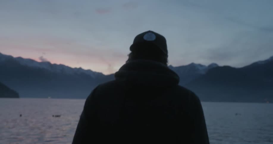 A man approaches a lake