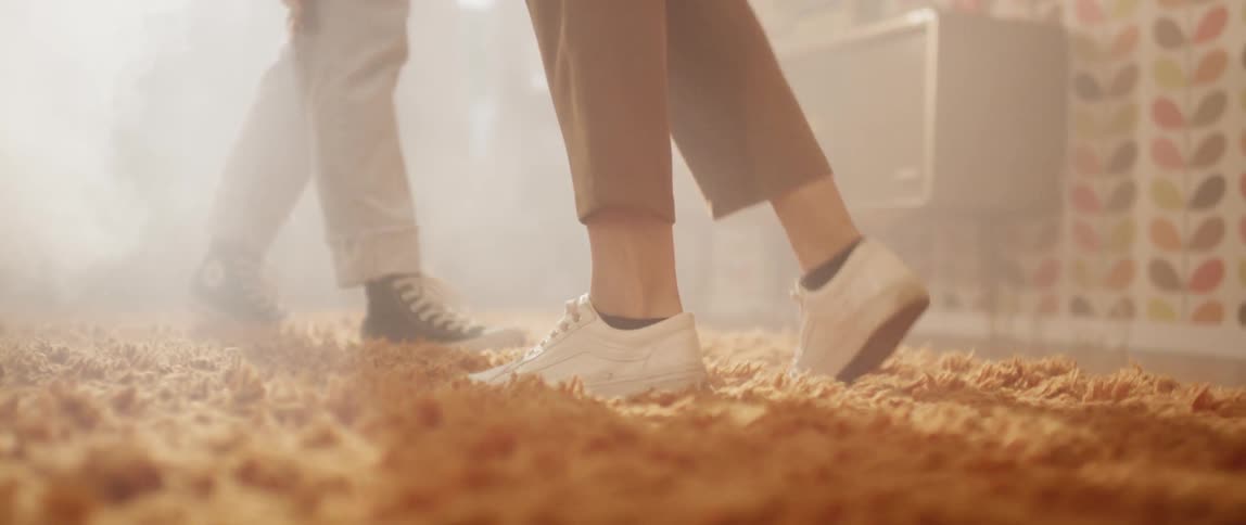 People are walking over the carpet together